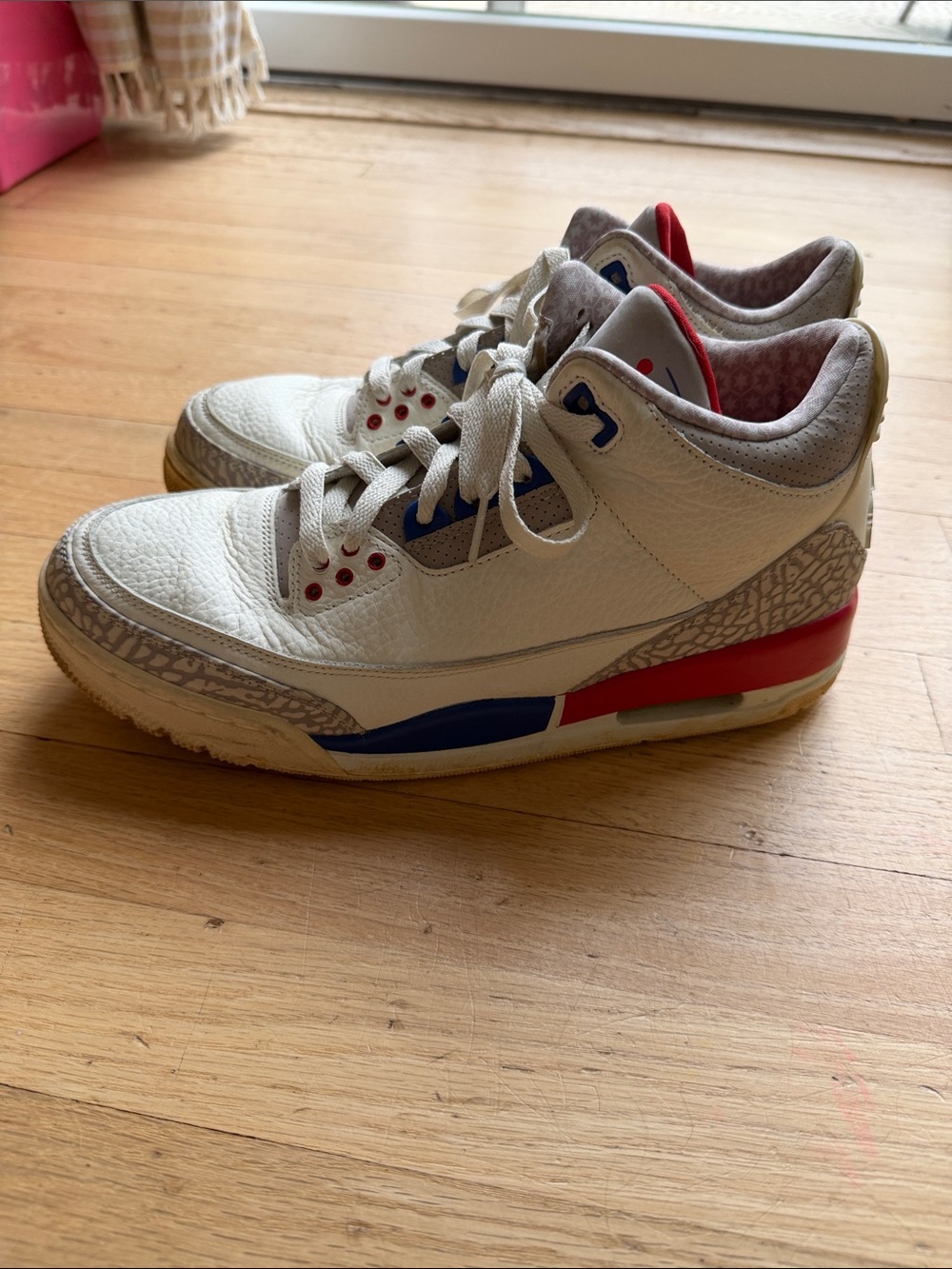 Nike White Sneakers with Blue & Red Accents